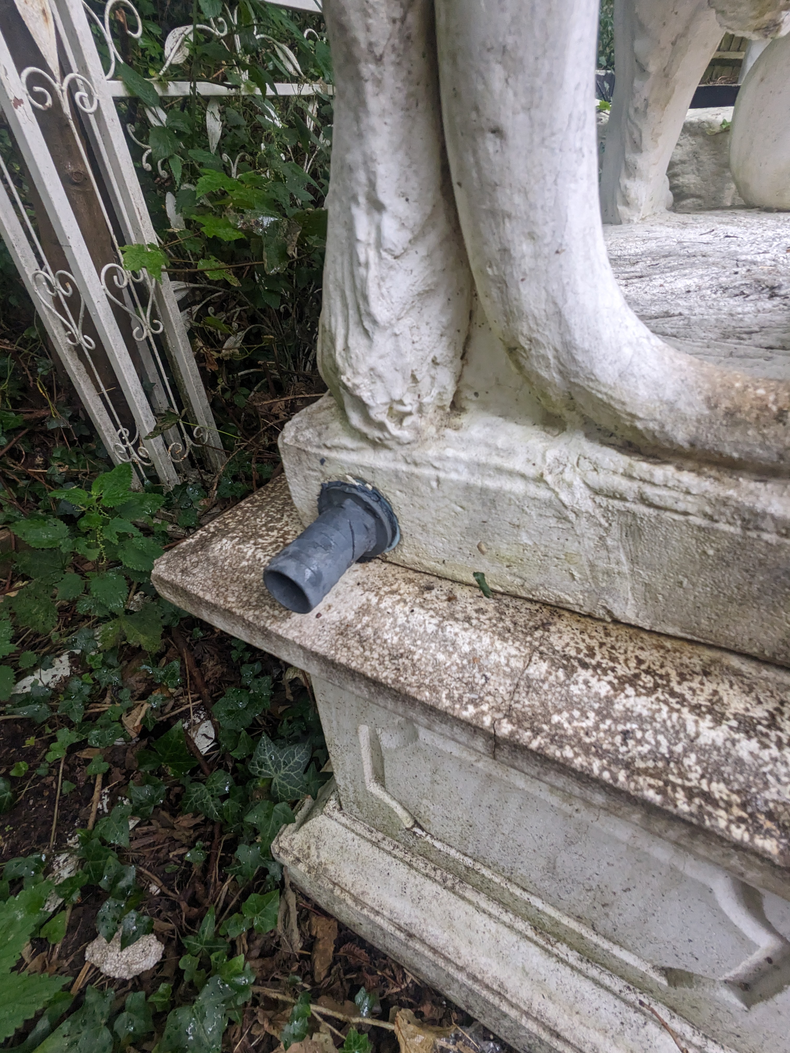 A pair of re-constituted stone models of lions standing upon rectangular plinths, fitted as fountains, Height 160cm., Viewing in Forest Row by arrangement. Purchaser to arrange for removal within one week of the sale dat